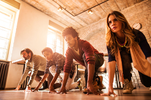 Low angle view of business team on starting line in the office,