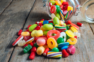 Colorful candy gum on old wooden table.